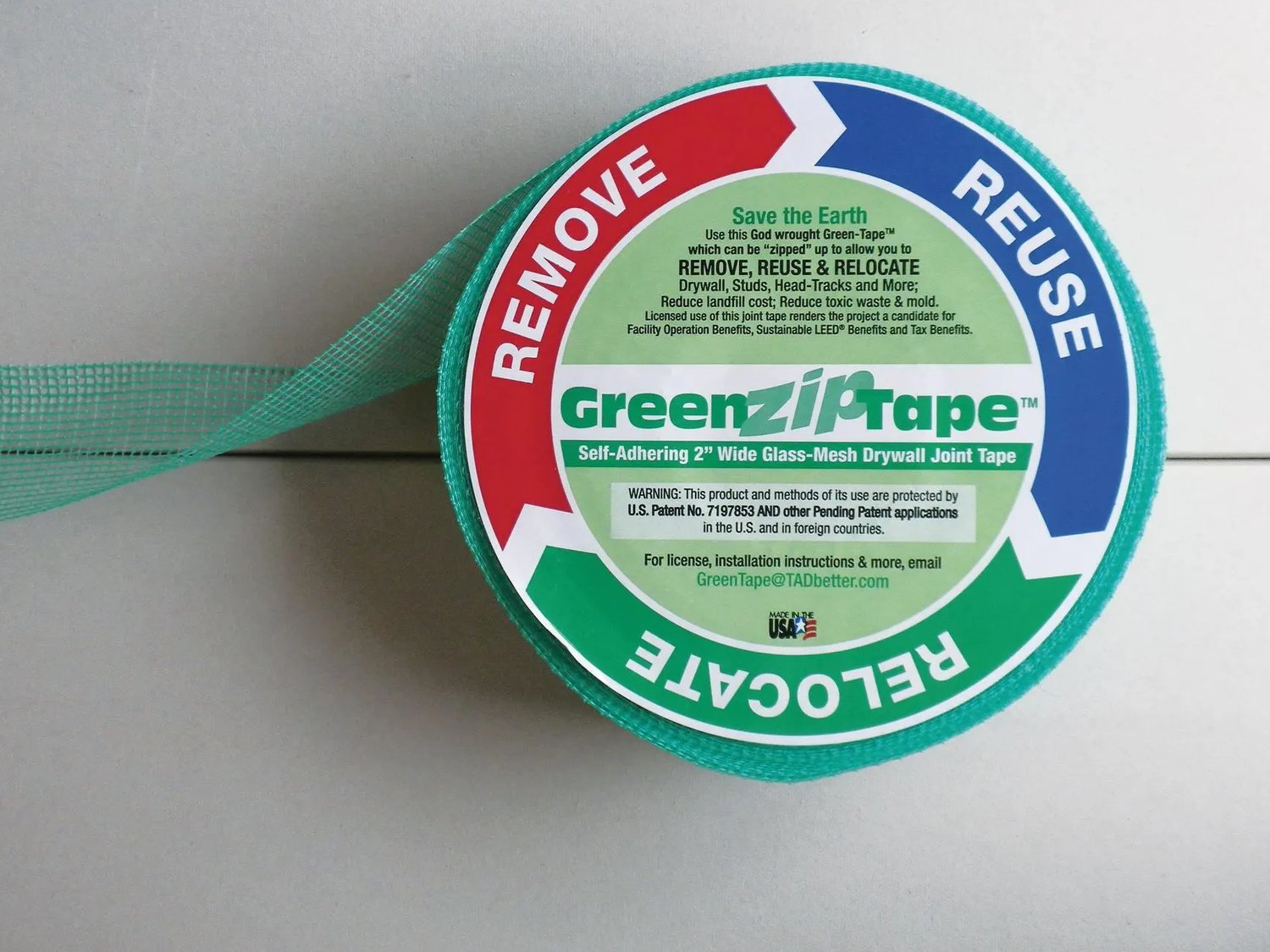 A roll of GreenZip Tape — green self-adhering glass-mesh drywall joint tape